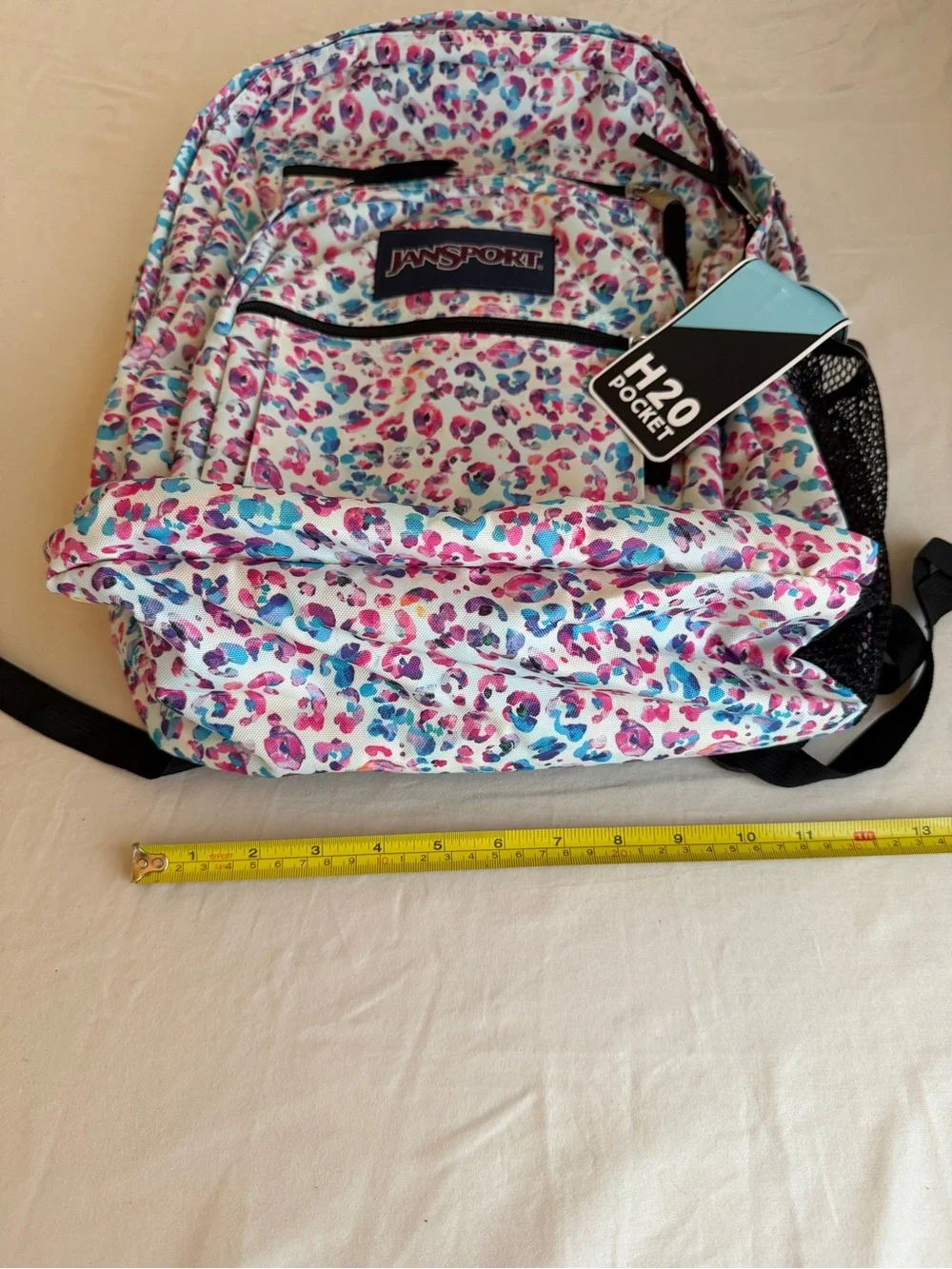 JanSport Backpack in White with Pink & Blue Leopard Print